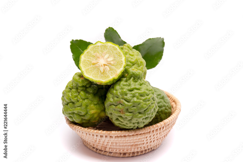 Fototapeta premium The kaffir lime leaves in the basket on a white background.