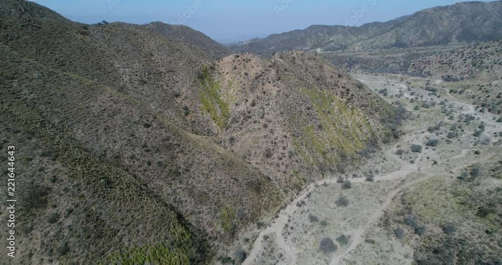 Aerial drone scene of Cable Car Chilecito - La Mejicana gold mine. General view of towers linear distribution in the middle of Famatina mountains and valleys. Camera approaches the constructions. Aerial drone scene of Cable Car Chilecito - La Mejicana gold mine. General view of towers linear distribution in the middle of Famatina mountains and valleys. Camera approaches the constructions.