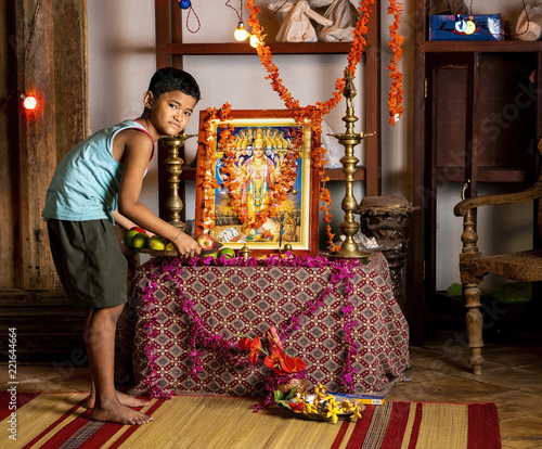 A Nepali boy at an altar (Staged) © Rajnesh
