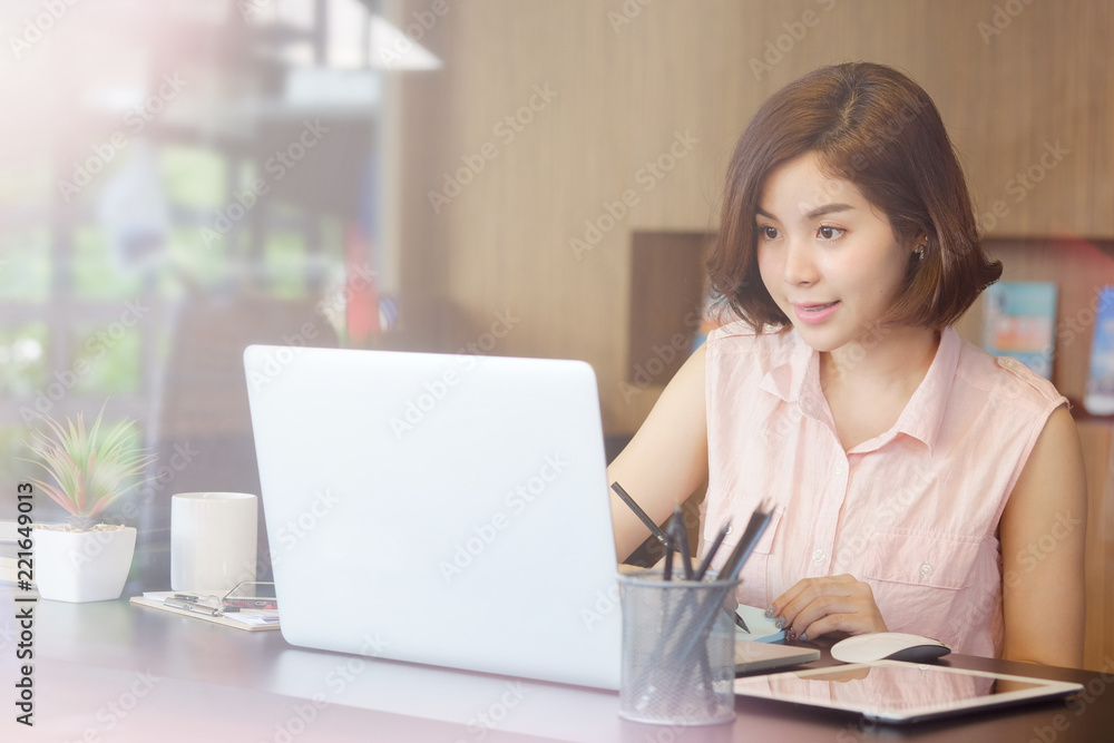 Asian working woman on workplace with laptop computer. Asian working woman on workplace with laptop computer.