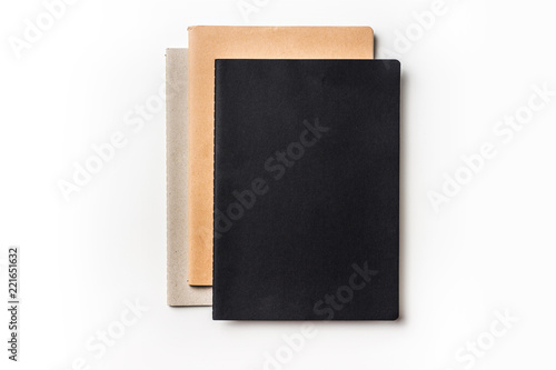Top view of 3 notebooks on white background