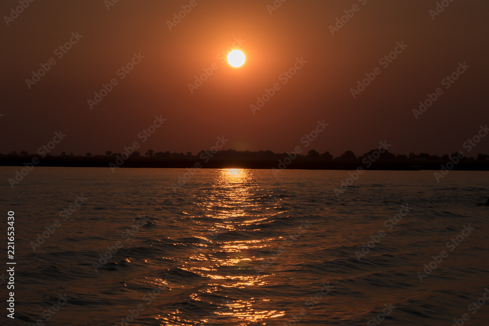 Naklejka premium Sunset over Chobe River, Botswana