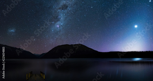 Panorama, Amanzing Starry night at Lake Rotoiti. Reflection of the Milky way and galaxy on the lake. Nelson Lake National Park, New Zealand.