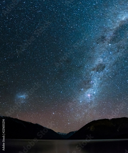 Amazing Starry night at Lake Rotoiti. Reflection of the Milky way and galaxy on the lake. Nelson Lake National Park, New Zealand. © Klanarong Chitmung