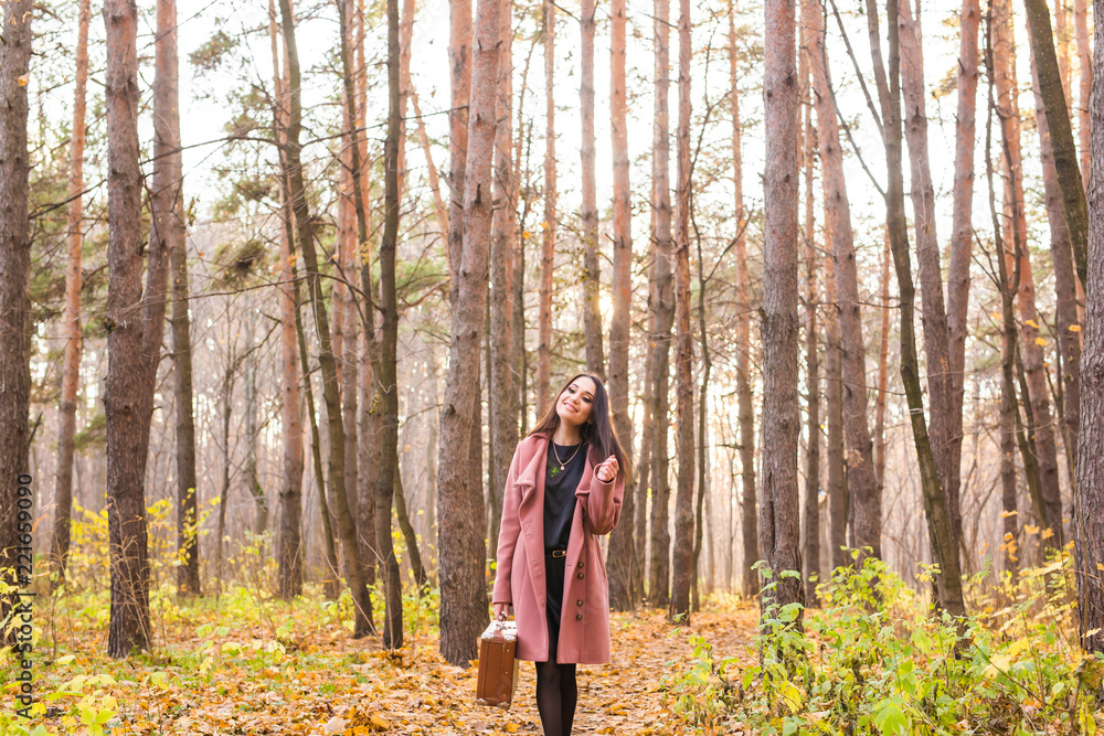 Season, fall and people concept - Portrait of a beautiful brunette woman in autumn nature Season, fall and people concept - Portrait of a beautiful brunette woman in autumn nature