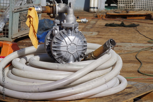 Transfer pump on a vessel deck. Pump used in tank cleaning.
