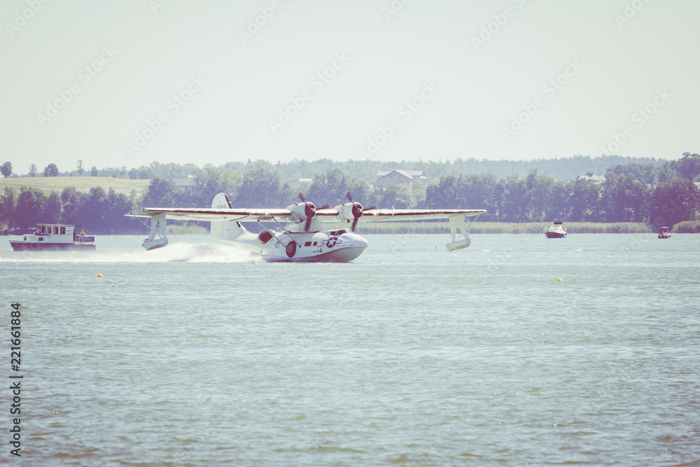 Obraz premium Flight Boat Consolidated PBY Catalina at Air Show Mazury 2018 event at the lake Niegocin in Gizycko. Poland.