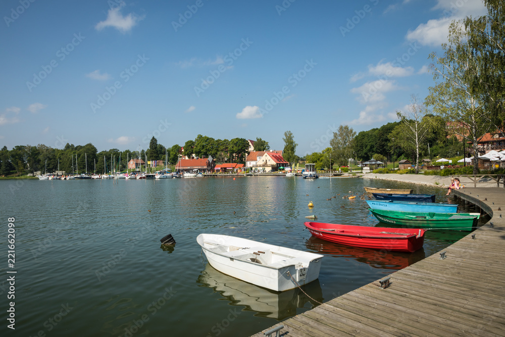Marina and pier on Rynskie lake, town of Ryn.