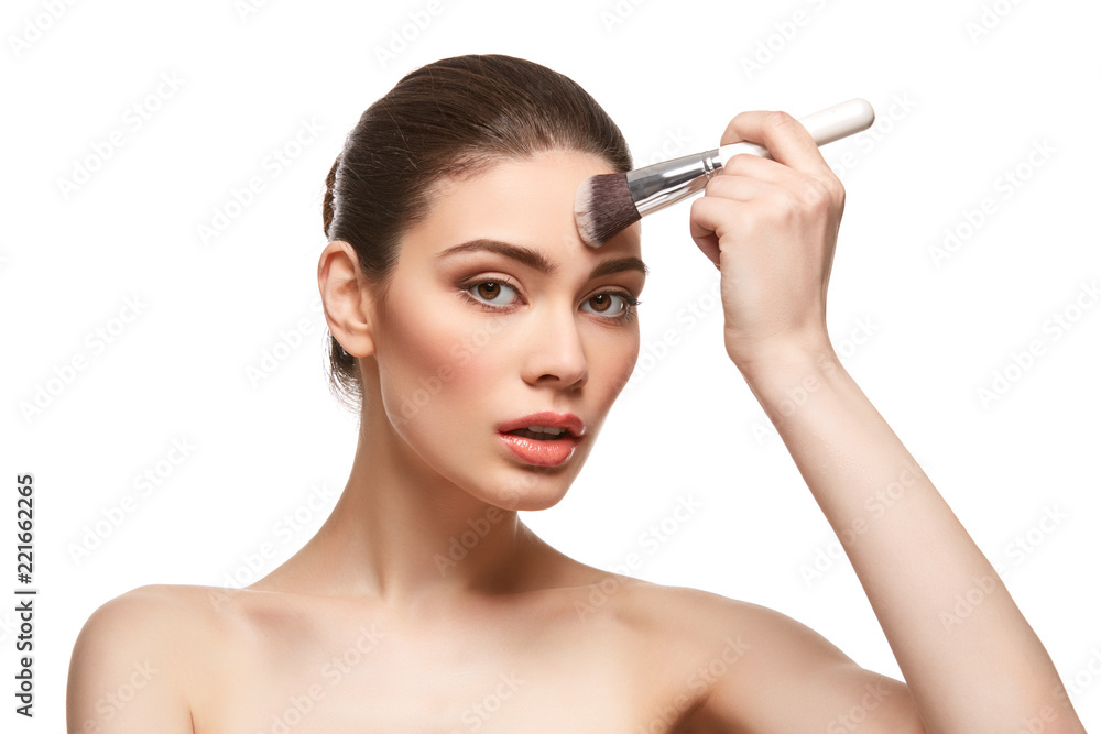 girl applying foundation on face isolated on white girl applying foundation on face isolated on white