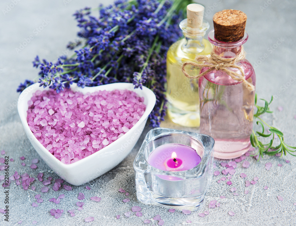 Heart-shaped bowl with sea salt and fresh lavender flowers Heart-shaped bowl with sea salt and fresh lavender flowers