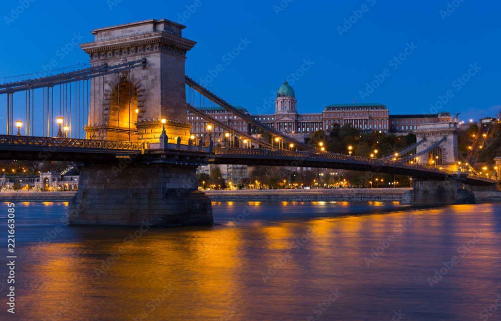 Image of Chain Bridge near Buda Fortress in evening illumination of Hungary