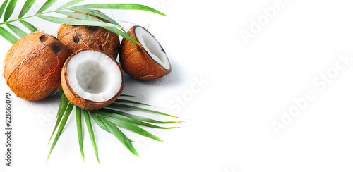 Coconut with coconuts palm tree leaf isolated on a white background. Fresh coco nut. Healthy food, skin care concept. Vegan food