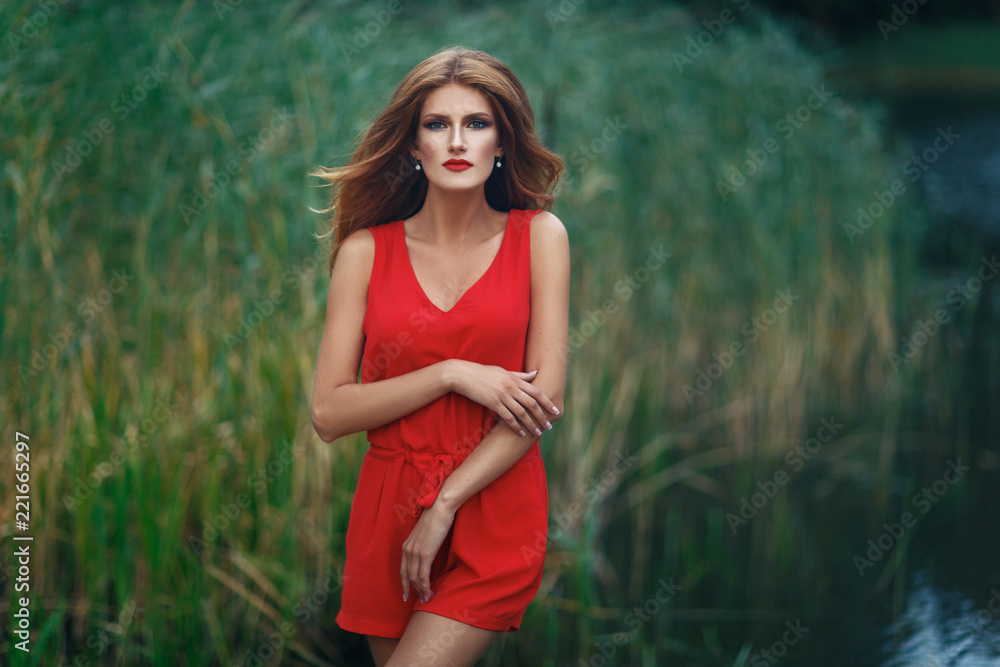 Fototapeta premium beautiful girl wiith red lips near lake