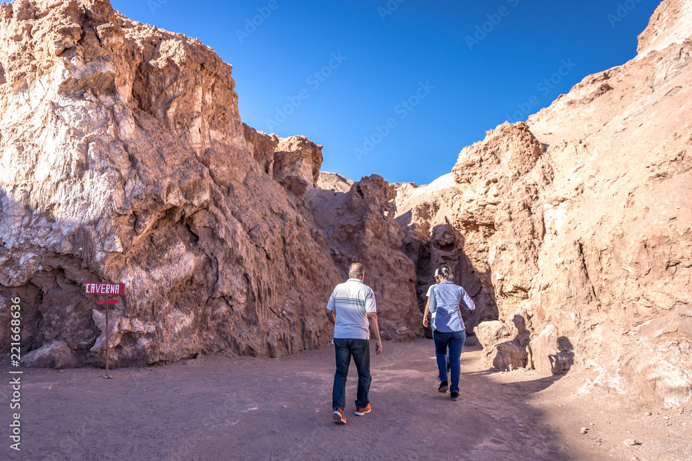 Atacama, Chile - Oct 8th 2017 - Tourists walking at the salt cave in the Atacama, one of the main tourist attraction at the Desert, Chile.