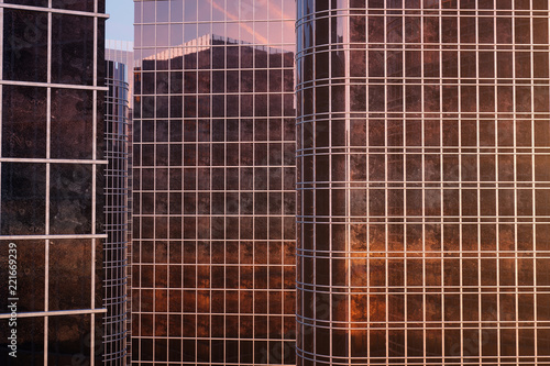 3D illustration Low angle view of skyscrapers. Skyscrapers at sunset looking up perspective. Bottom view of skyscrapers in business district in evening light or sunset. Business concept of success