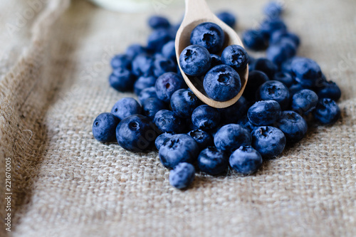Fresh sweet blueberry fruit in spoon. Shallow depth of field