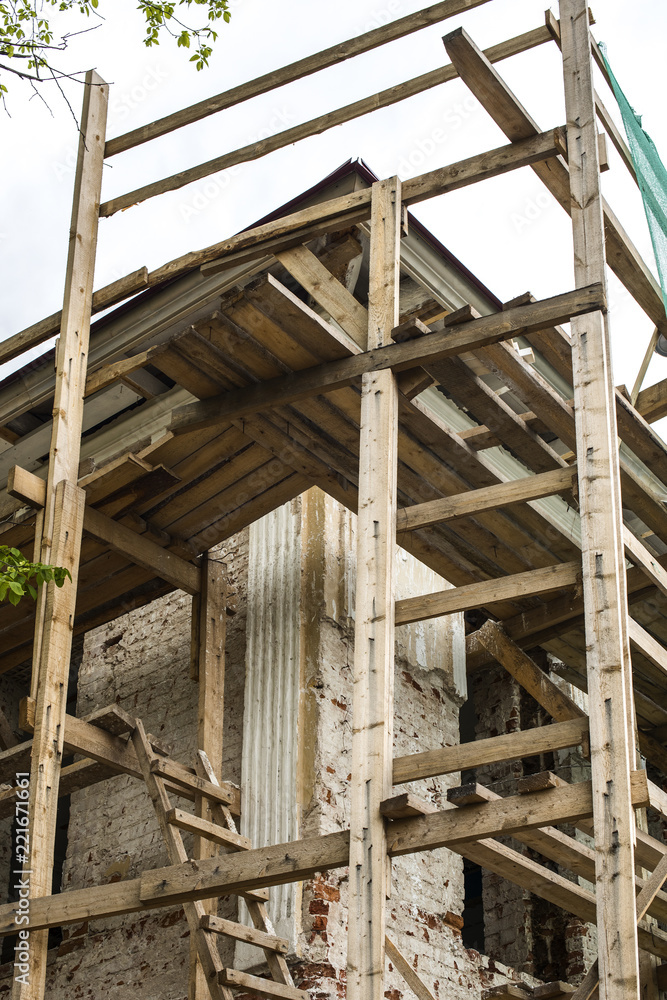 Wooden scaffolding around the ancient building Wooden scaffolding around the ancient building