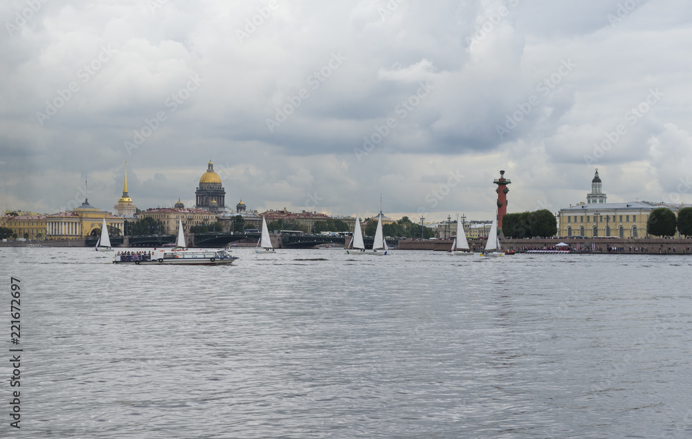view of St. Petersburg from the Neva River, a boat and sailing boats on the Neva River, the dome of St. Isaac's Cathedral, a view of the Admiralty building, the city landscape