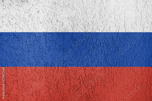 The texture of the flag of Russia on the wall of plaster.