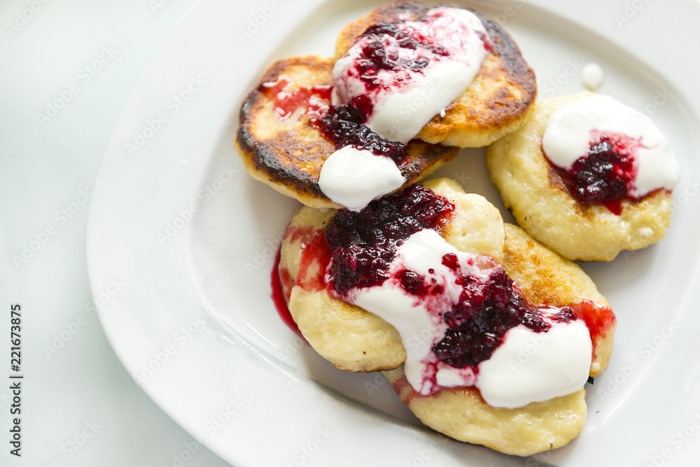 cottage cheese pancakes, cottage cheese pancakes with cranberry sauce on plate, delicious Breakfast