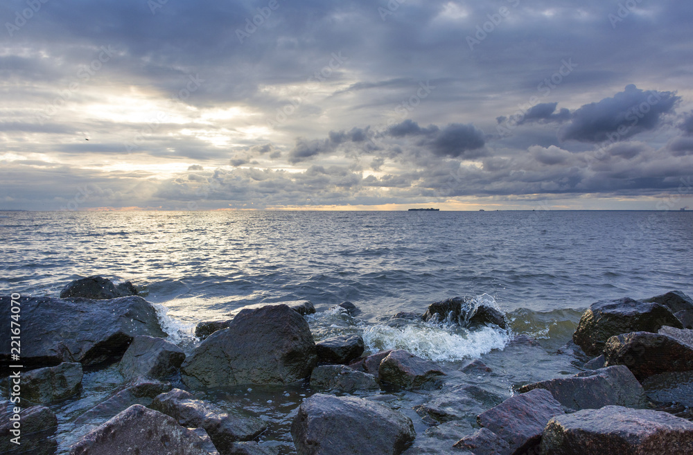 surf line with boulders, Gulf of Finland at sunset, sea water, sunset sky, Russia