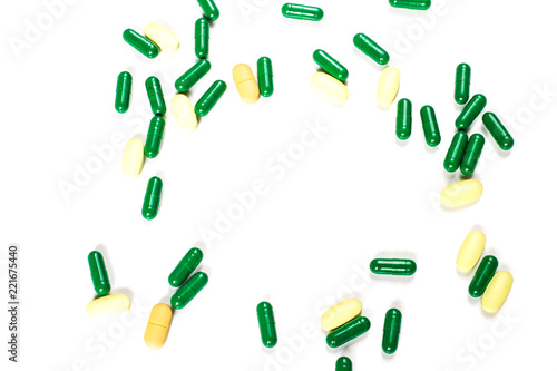 Medicine green and yellow pills or capsules
