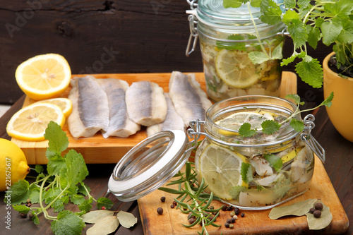 Принти на полотні Healthy fresh marinated herring fillet with lemon, pepper, herbs, and onion