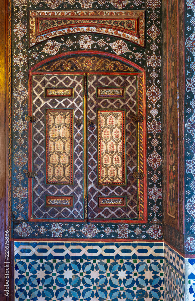 Embedded vintage cupboard painted with colorful floral patterns at Syrian hall of historic Manial palace of Prince Mohammed Ali, Cairo, Egypt