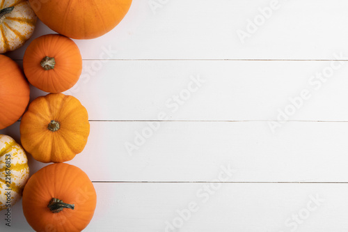 Pumpkins on wooden background