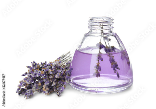 Fototapeta Naklejka Na Ścianę i Meble -  Bottle with aromatic lavender oil on white background