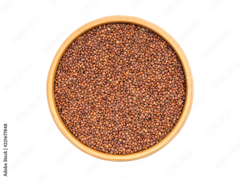 Red quinoa seeds in a wooden bowl seen directly from above and isolated on white background Red quinoa seeds in a wooden bowl seen directly from above and isolated on white background