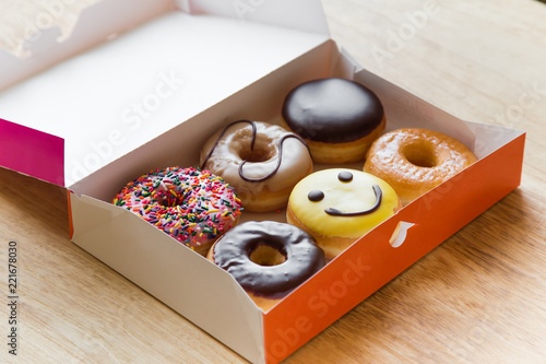 Colorful donuts in box