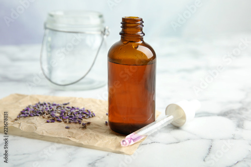 Fototapeta Naklejka Na Ścianę i Meble -  Natural herbal oil and lavender on marble table