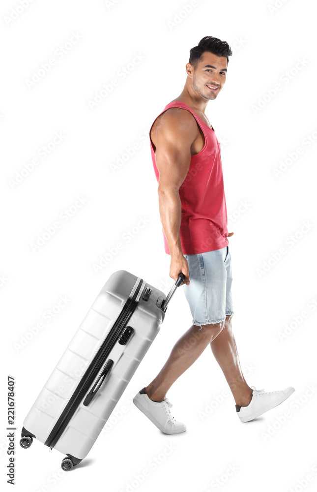 Young man walking with suitcase on white background Young man walking with suitcase on white background