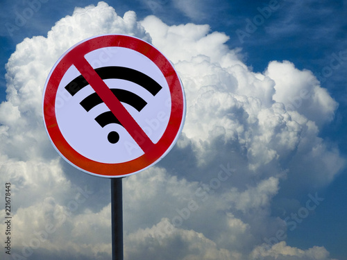Road sign no wifi on sky background with clouds.
