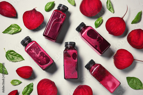 Flat lay composition with beet smoothies on light background