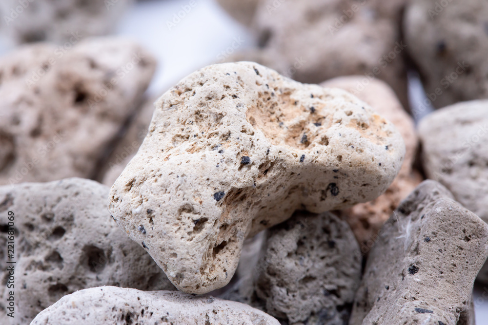 A natural piece of pumice stone isolated on white background.