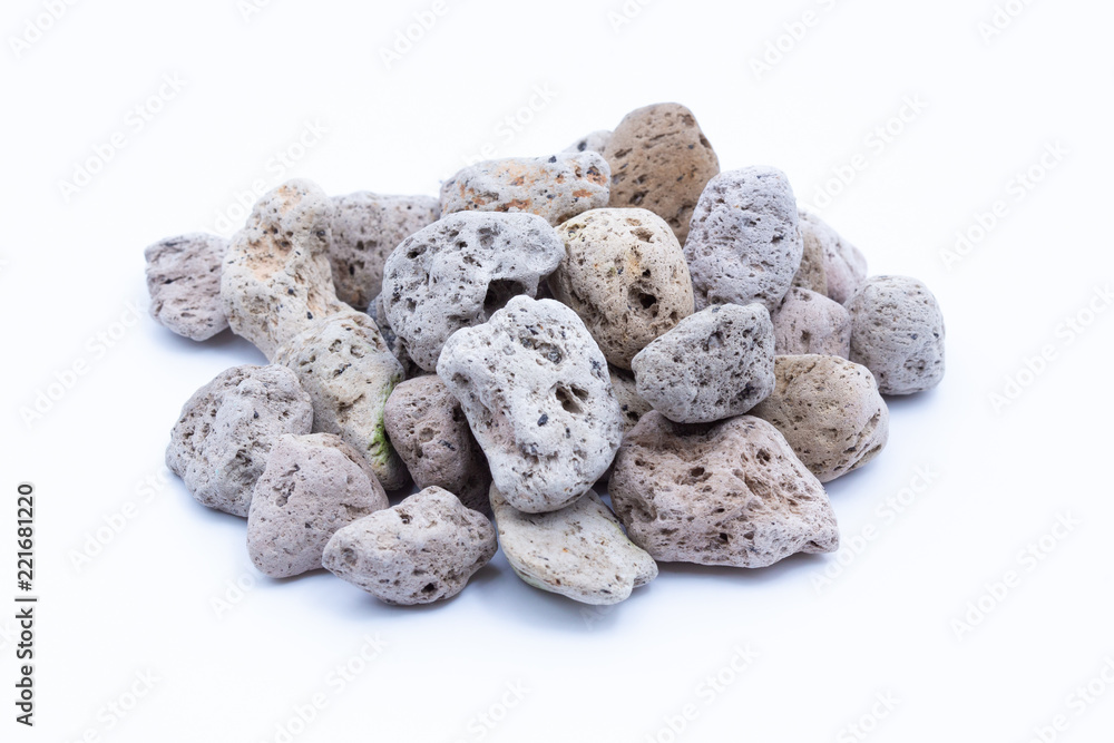 A natural piece of pumice stone isolated on white background. A natural piece of pumice stone isolated on white background.