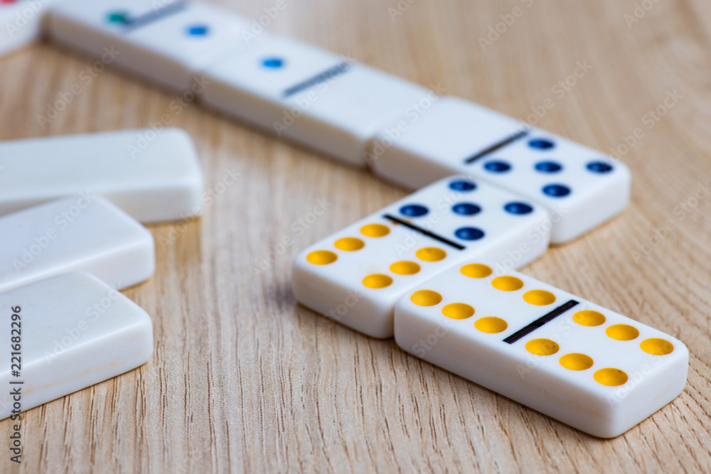 Domino tiles on wooden background Domino tiles on wooden background