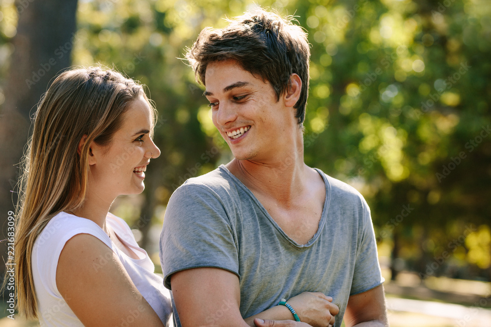 Smiling couple having fun in a park Smiling couple having fun in a park