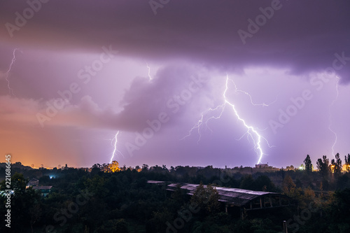 Lightning strikes during thunderstorm over the city