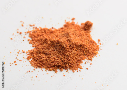 Pile of ground red pepper. Macro with shallow depth of field.