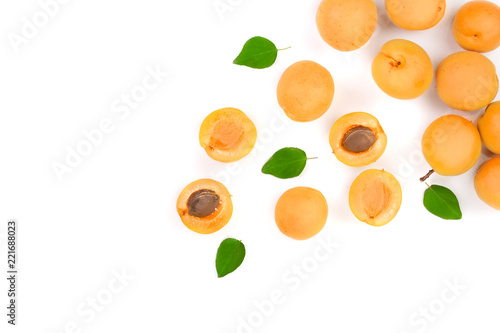 Apricot fruits with leaves isolated on white background with copy space for your text. Top view. Flat lay pattern