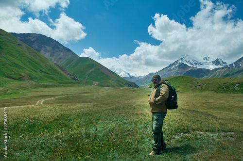 caucasian man with backpacks View from p Pamir