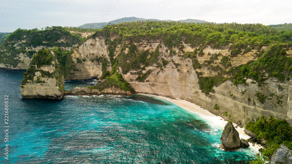 Aerial view of tropical rocky cliff coastline