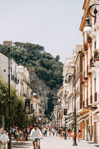 Fototapeta Naklejka Na Ścianę i Meble -  Views of the city of Sorrento in Italy, panorama and top view. Night and day, the streets and the coast. Beautiful landscape and brick roofs. Architecture and monuments of antiquity. Shops and street