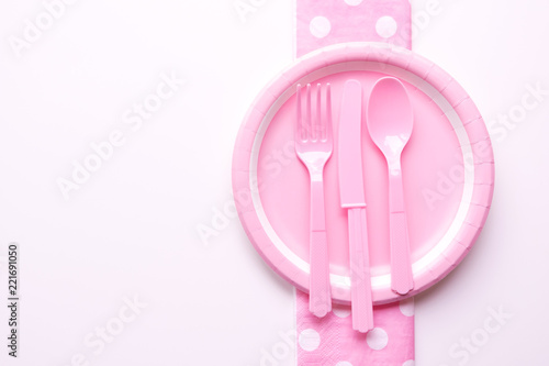 Pink color paper plate with plastic spoon  fork and knife for children party design
