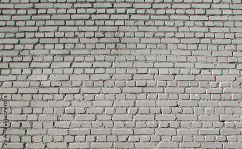 brick white wall textured and with a clear pattern of light