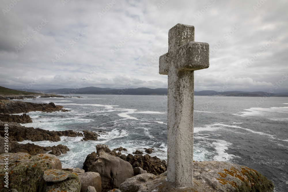memorial cross for lost fishermen on Cape Roncudo (Faro de Cabo Roncudo) on the coast of death (costa da more ) in galicia, spain memorial cross for lost fishermen on Cape Roncudo (Faro de Cabo Roncudo) on the coast of death (costa da more ) in galicia, spain