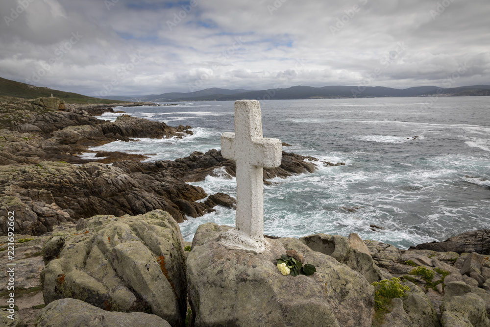 memorial cross for lost fishermen on Cape Roncudo (Faro de Cabo Roncudo) on the coast of death (costa da more ) in galicia, spain memorial cross for lost fishermen on Cape Roncudo (Faro de Cabo Roncudo) on the coast of death (costa da more ) in galicia, spain